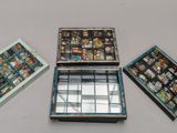 three boxes with pictures on them sitting on a table