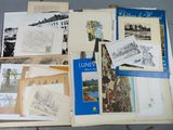a lot of old books that are on a table