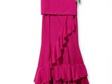 pink dress with ruffles on a hanger on a white background