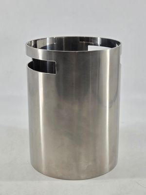 a metal trash can that has a handle on it