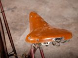 a bike that has a saddle on the back of it