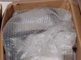 two boxes of plastic wrap sitting on a table