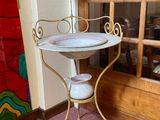 a small table with a mirror on top of it