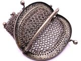 an image of a close up of a metal object on a white surface