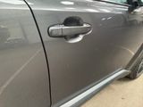 a close up of a door handle on a car