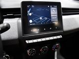 the dashboard of a car with a gps device in the center