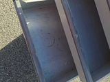 three open drawers sitting on the ground next to each other