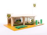 a small model of a gas station with a gas pump