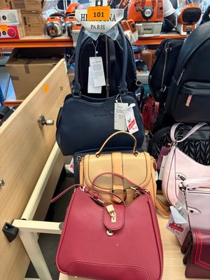 a lot of bags that are sitting on a table