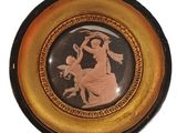 a plate with a picture of a woman and a man on it