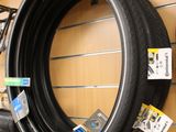 a tire tire hanging on a wall in a store