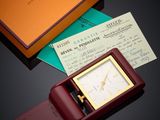 an image of a watch sitting on top of a table next to a box