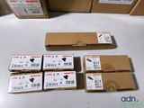 several boxes of electronic equipment sitting on top of a table