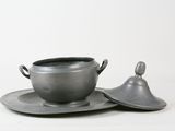 a cup and saucer sitting on a saucer on a saucer