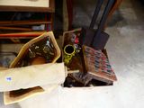 a bag of items sitting on the floor next to an open suitcase