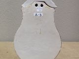 a white snowman that is sitting on a table