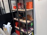 a book shelf that has a lot of books on it