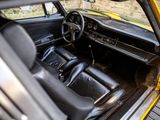 a yellow car with black seats and a steering wheel