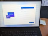 a laptop that is sitting on a table with a keyboard