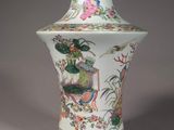 a white vase with flowers and birds on it