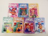 six children ' s books about angels and mermaids on a table