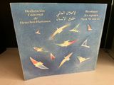 a picture of a book with a picture of birds flying in the sky