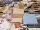 a pile of towels and other items on a table
