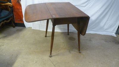 a small table that has a drop leaf on it