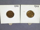 two coins sitting on top of each other on a table