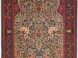 un tapis persan antique avec un motif floral sur fond blanc