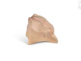 a small piece of clay that is sitting on a white surface
