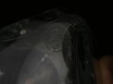 a close up of a person holding a clear bag