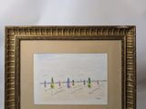 painting of a group of people walking on a beach in a gold frame