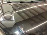 a close up of a car ' s windshield with a cell phone on it