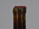 a close up of a bottle of wine on a table