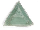 a triangle shaped glass object on a white surface