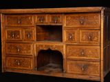 a wooden cabinet with many drawers and drawers on it