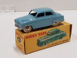 a blue toy car sitting on top of a box