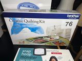 two sewing machines that are sitting on a table