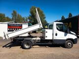 a white truck that is parked in the dirt