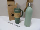 a bottle and a cup on a table next to a cardboard box