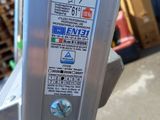 a close up of a parking meter with a lot of stickers on it