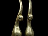 a pair of bronze sculptures of a woman ' s head and a man ' s head