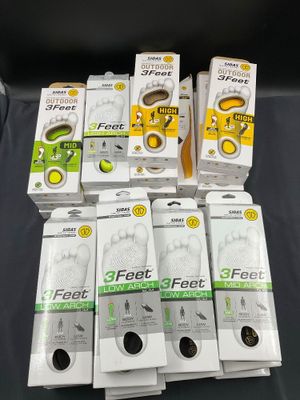 six pairs of feet and one pair of feet are on a table