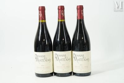three bottles of wine sitting on top of a table next to each other