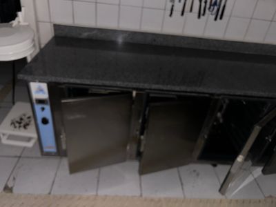a picture of a kitchen with a sink and a microwave