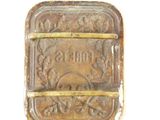 an old metal belt buckle with the word forbess on it