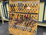 a yellow workbench with many different tools on it