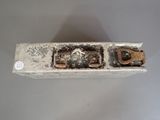 a picture of a broken toilet seat with the lid down
