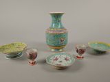 many different types of vases and bowls on the table
